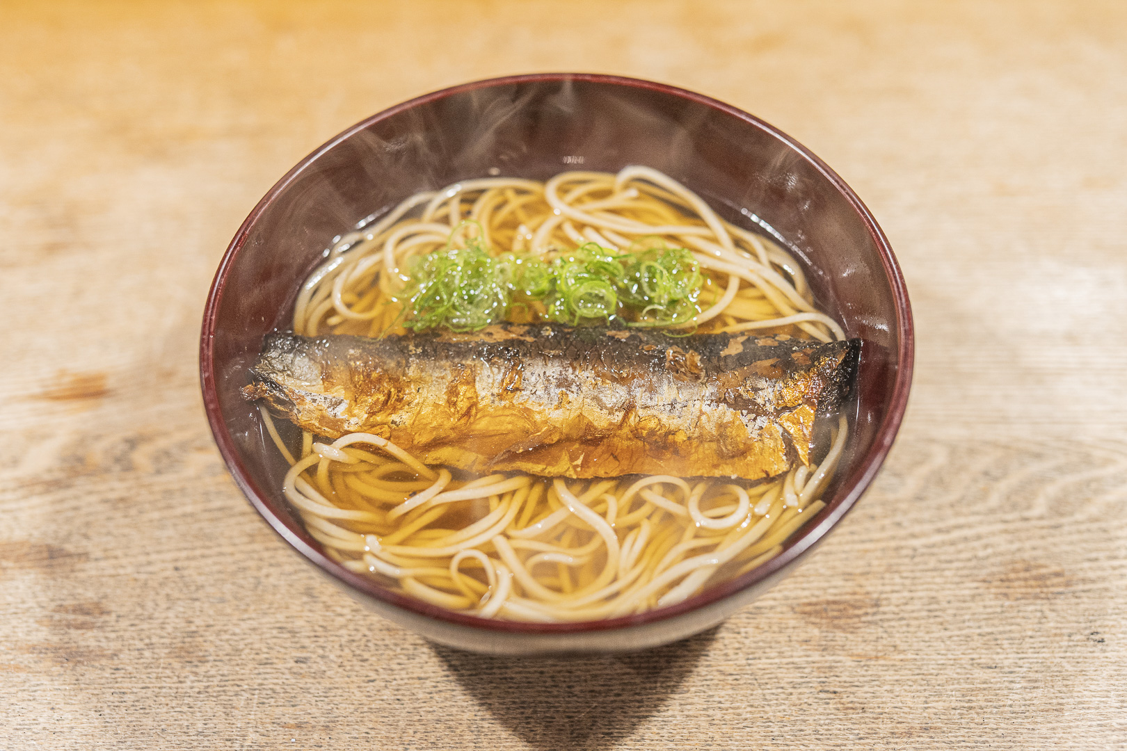 Sobanomi Yoshimura: a bowl of soba in broth topped with a long piece of fish and scallion.