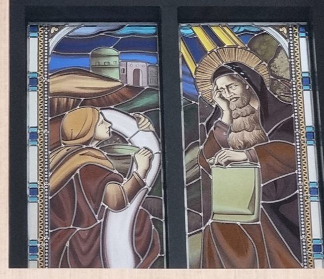 레베카 성녀가 아브라함의 종에게 물을 마시게 해주는 장면을 그린 유리화입니다. 목포 산정동성당에 있습니다.