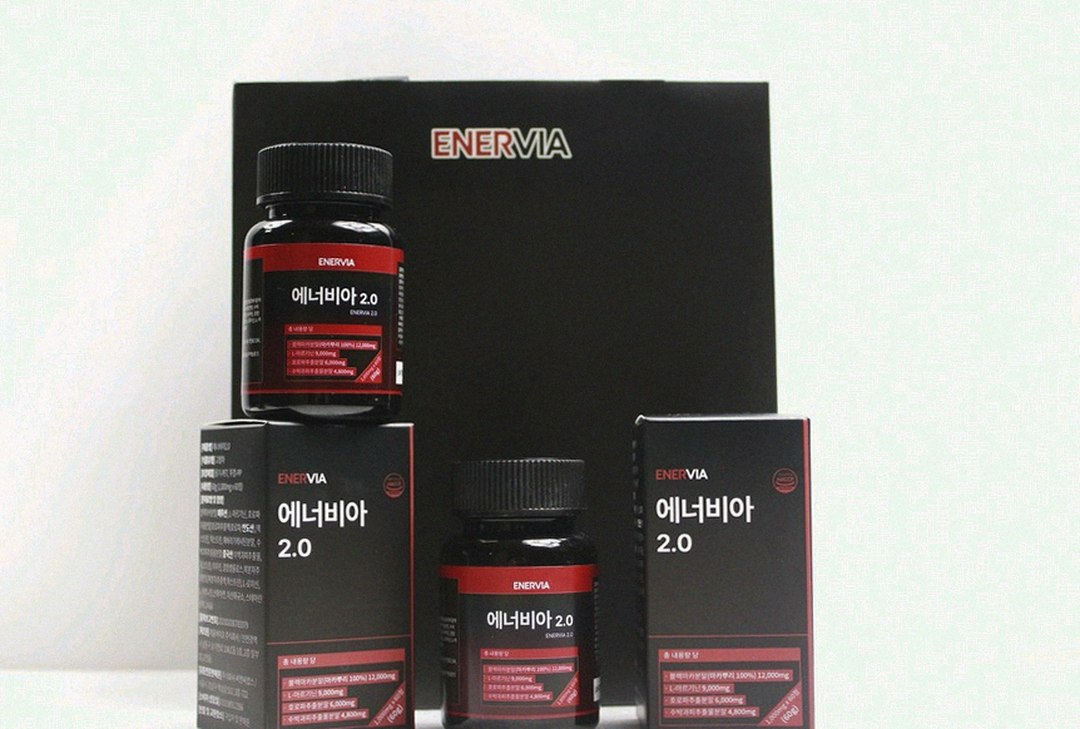 enervia 2.0 supplement bottle on office desk with water glass