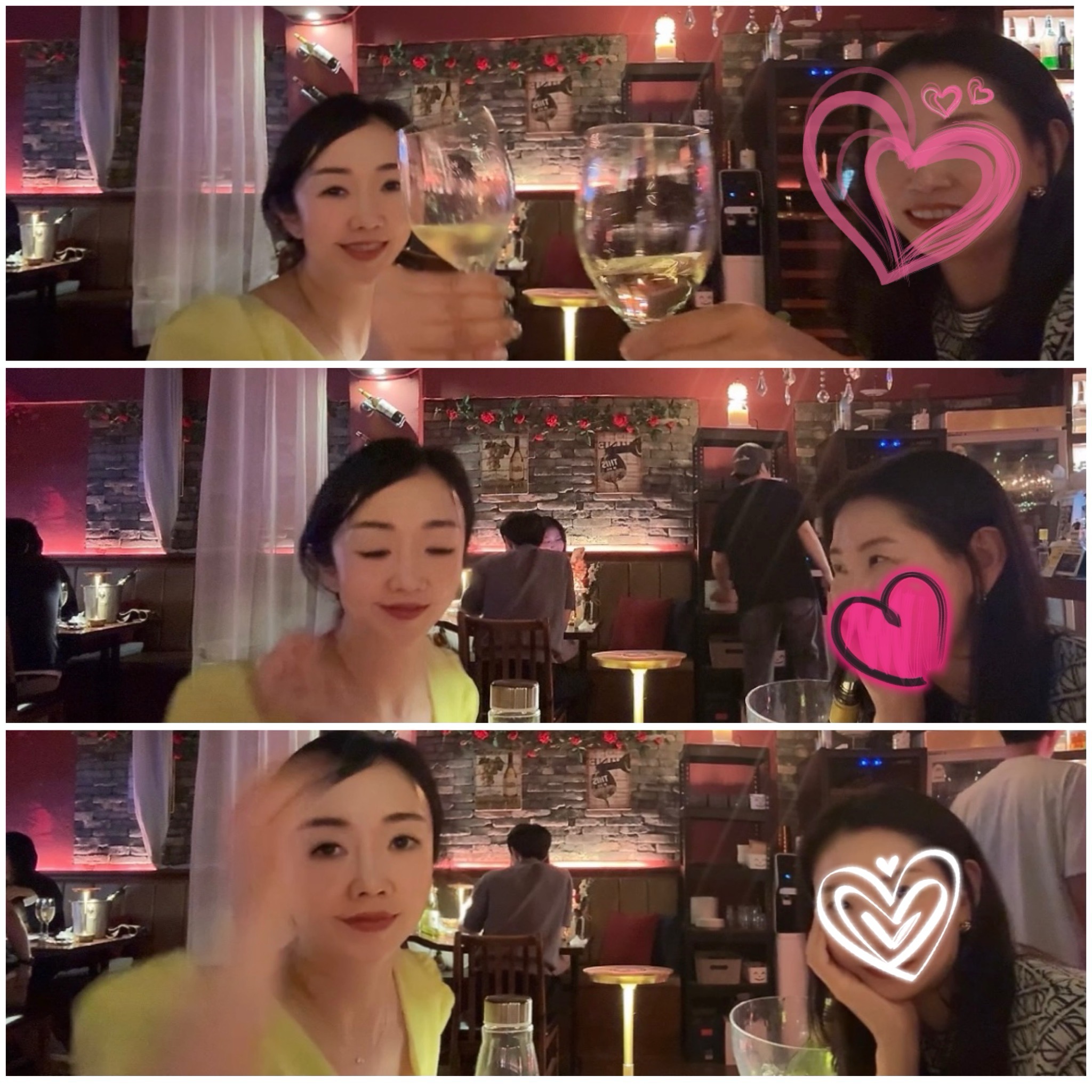 논현동 비노비스 와인바에서 두 여성이 와인잔을 들고 짠하며 셀카를 찍는 모습. 따뜻한 조명과 벽 장식이 분위기를 더하며, 친구의 얼굴에는 귀여운 하트 스티커로 모자이크가 되어 있다.