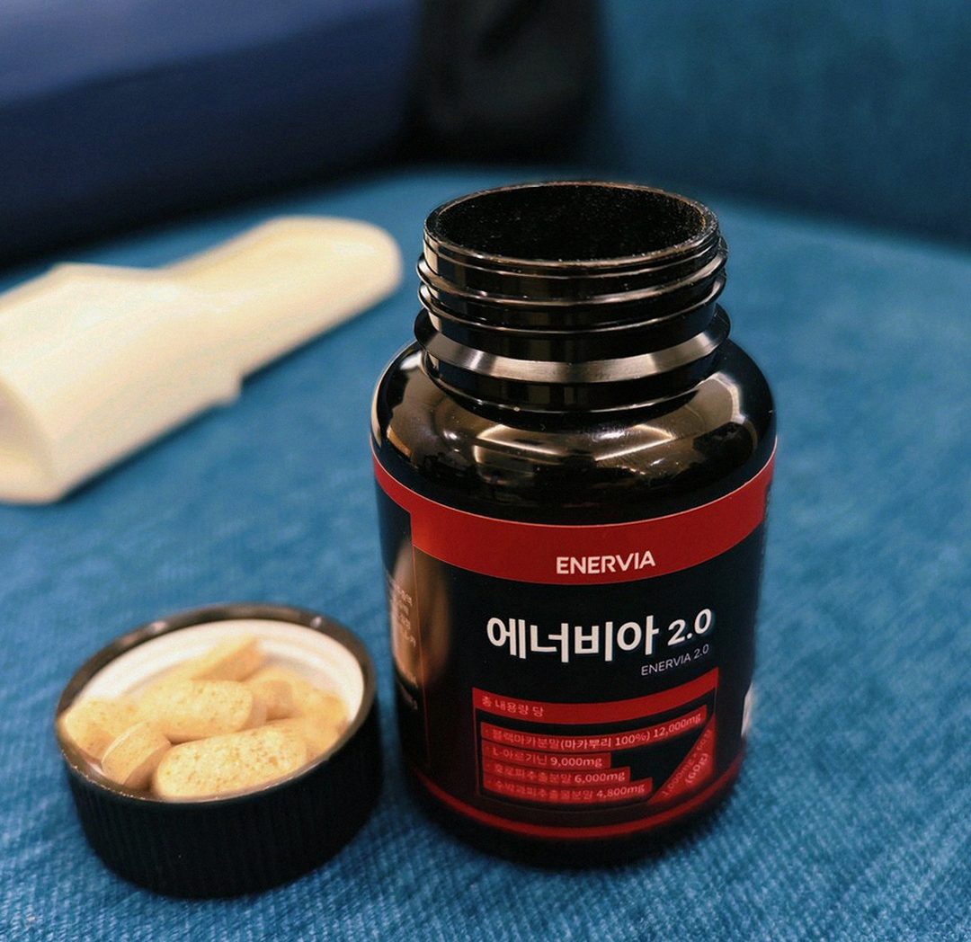 Korean Asian man having breakfast with supplement