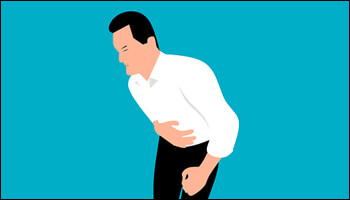 위통으로 몸을 숙이고 있는 남성