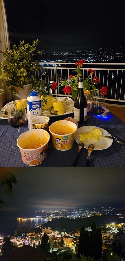 타오르미나-야경-불닭볶음면과-와인이-놓인-테이블