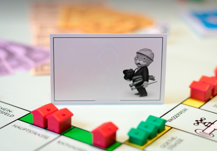 monopoly board with a miniature homes