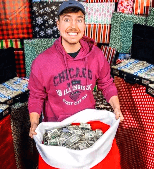 빨간 성탄절 선물 주머니에 미국 달러가 한가득 있고 그걸 들고 웃고있는 미스터 비스트의 얼굴이 정면을 바라보고 있다.