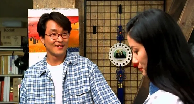 영화 8월의 크리스마스에서 정원이 미소 짓는 장면