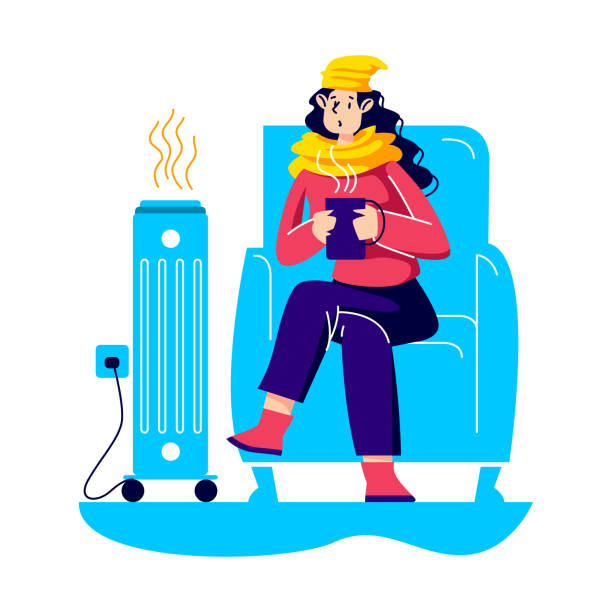 히터옆에서-커피를-마시는-여성