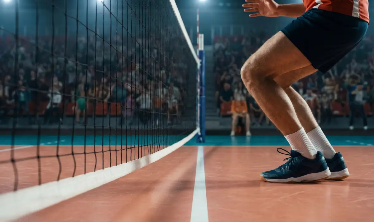 블로킹 후 착지 과정에서 네트와의 접촉을 피하려는 선수의 동작