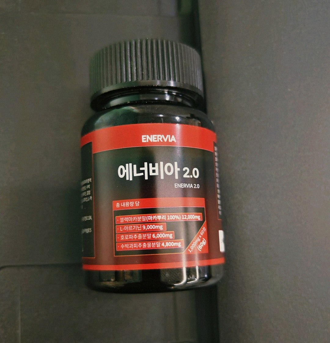 Korean Asian man in 40s waking up early morning dark room stretching tired