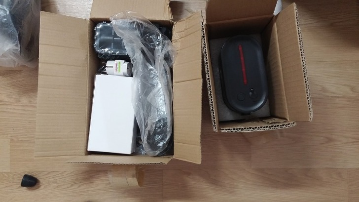 Accessories and parts of the Ideawalk electric bike packed separately in small boxes