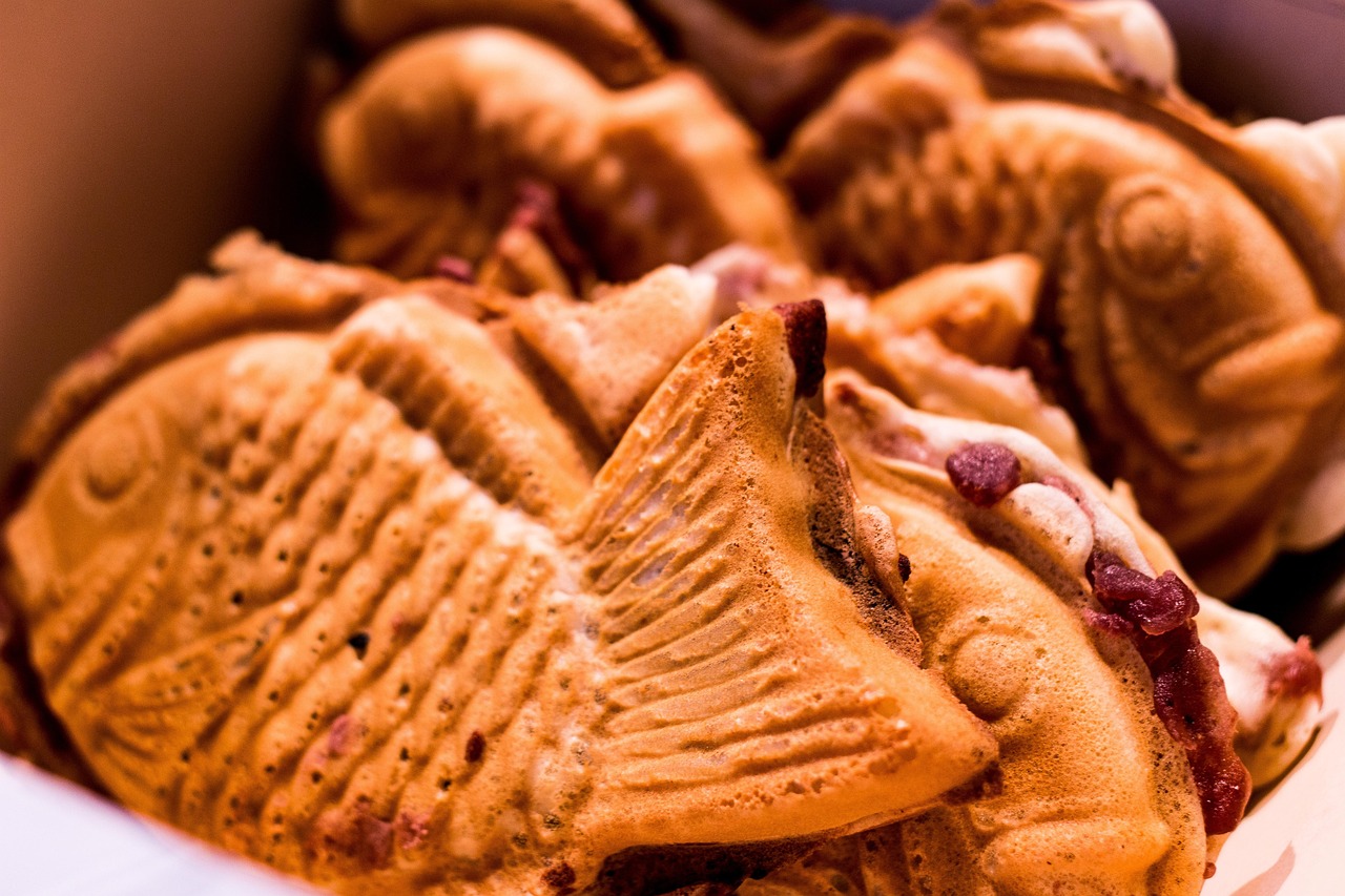 Bungeoppang, Korean fish-shaped pastry filled with sweet red bean paste, stacked together.