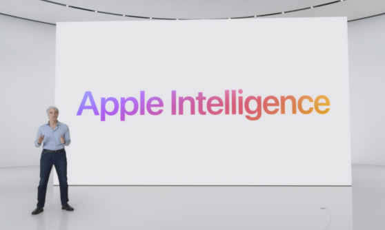 애플관계자가 애플 인텔이젼스라고 적힌곳 앞에서 설명하는 사진