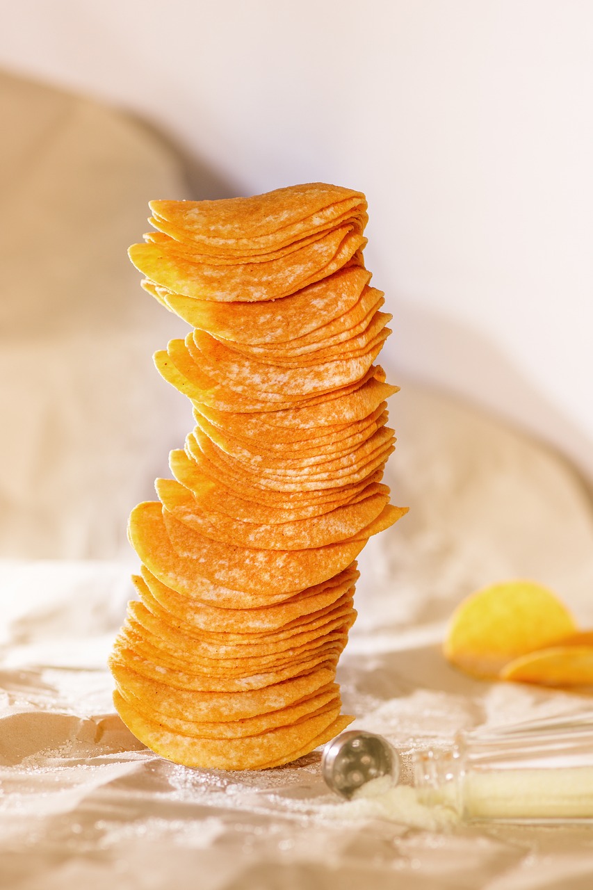 Potato chips piled up at an angle and looked uneasy