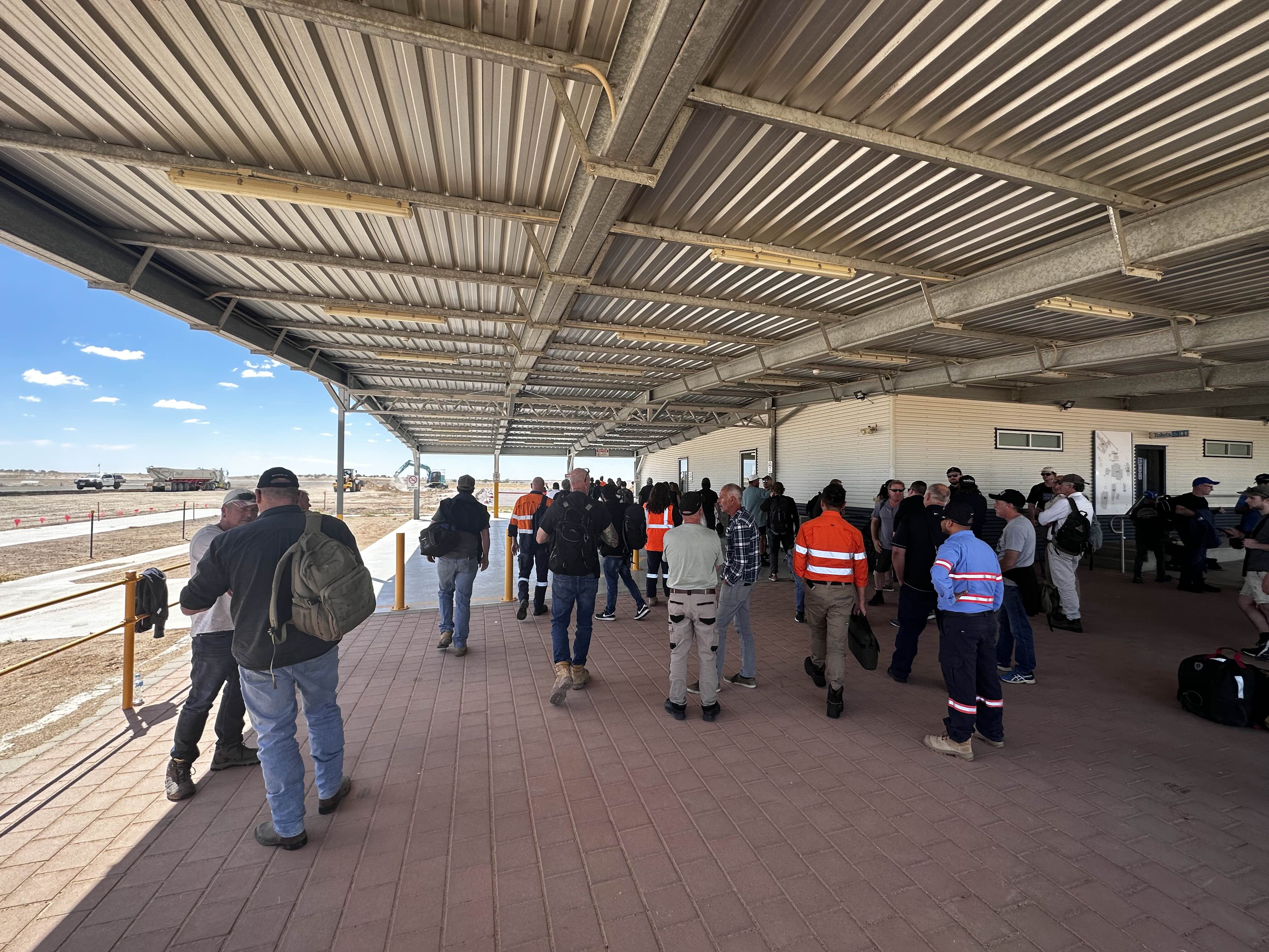 people waiting for bags