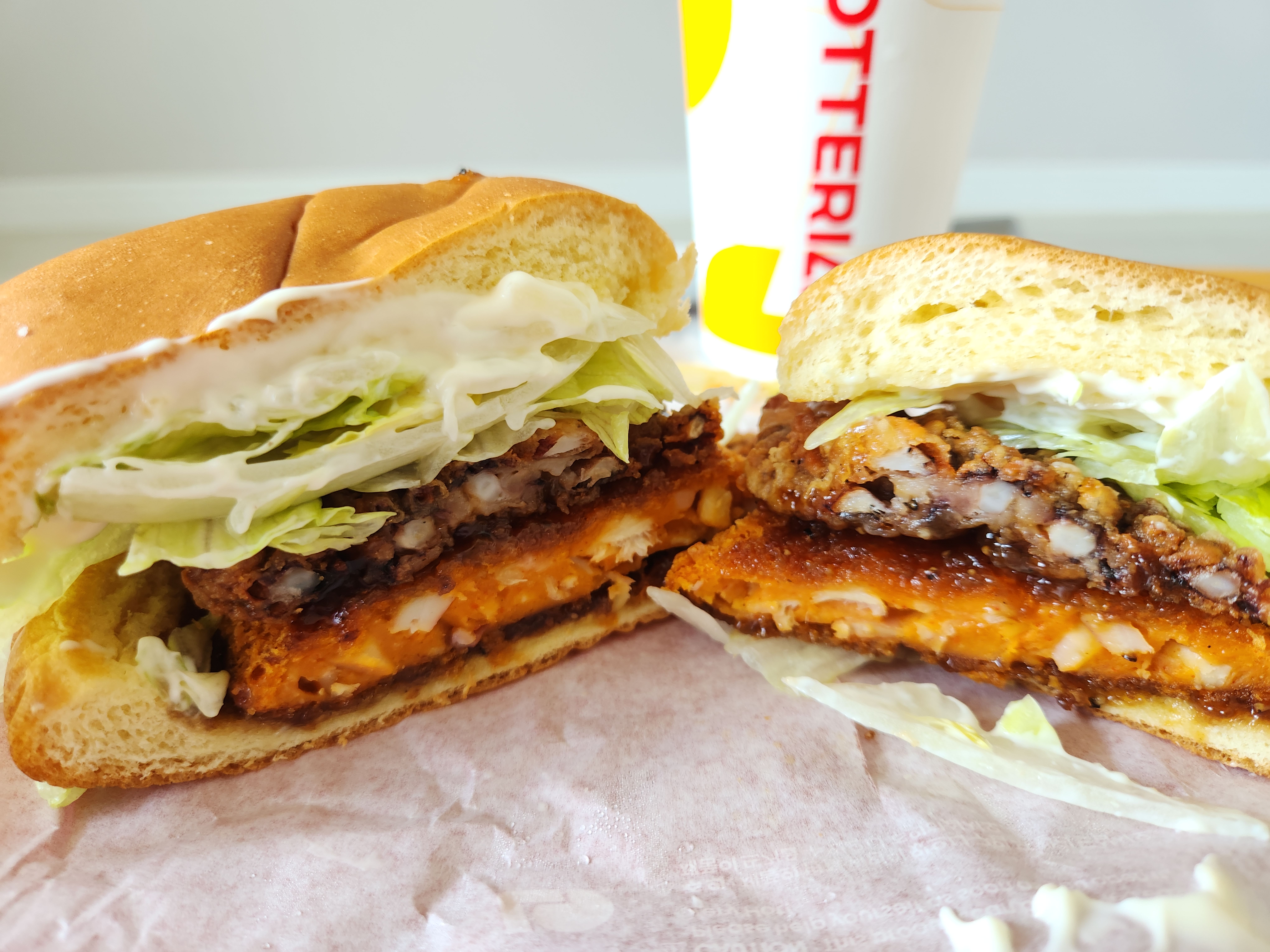 Cross-section of Lotteria's squid burger cut in half